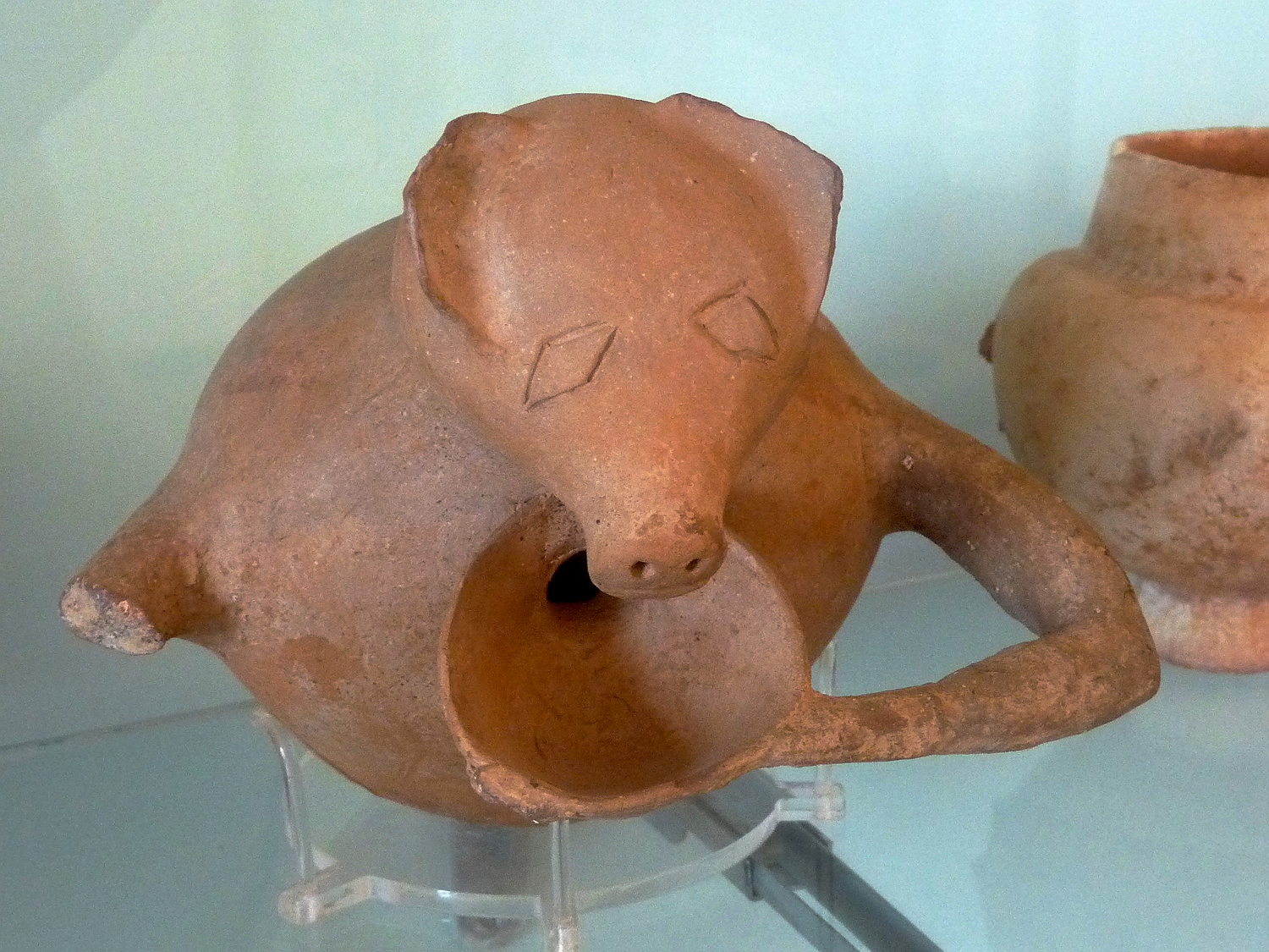 cycladic clay vessel shaped as pig